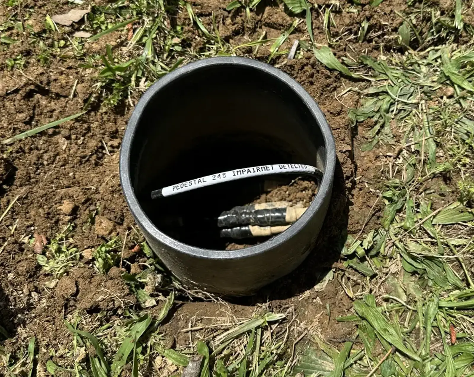 Restored outside plant access point after underground cable repair
